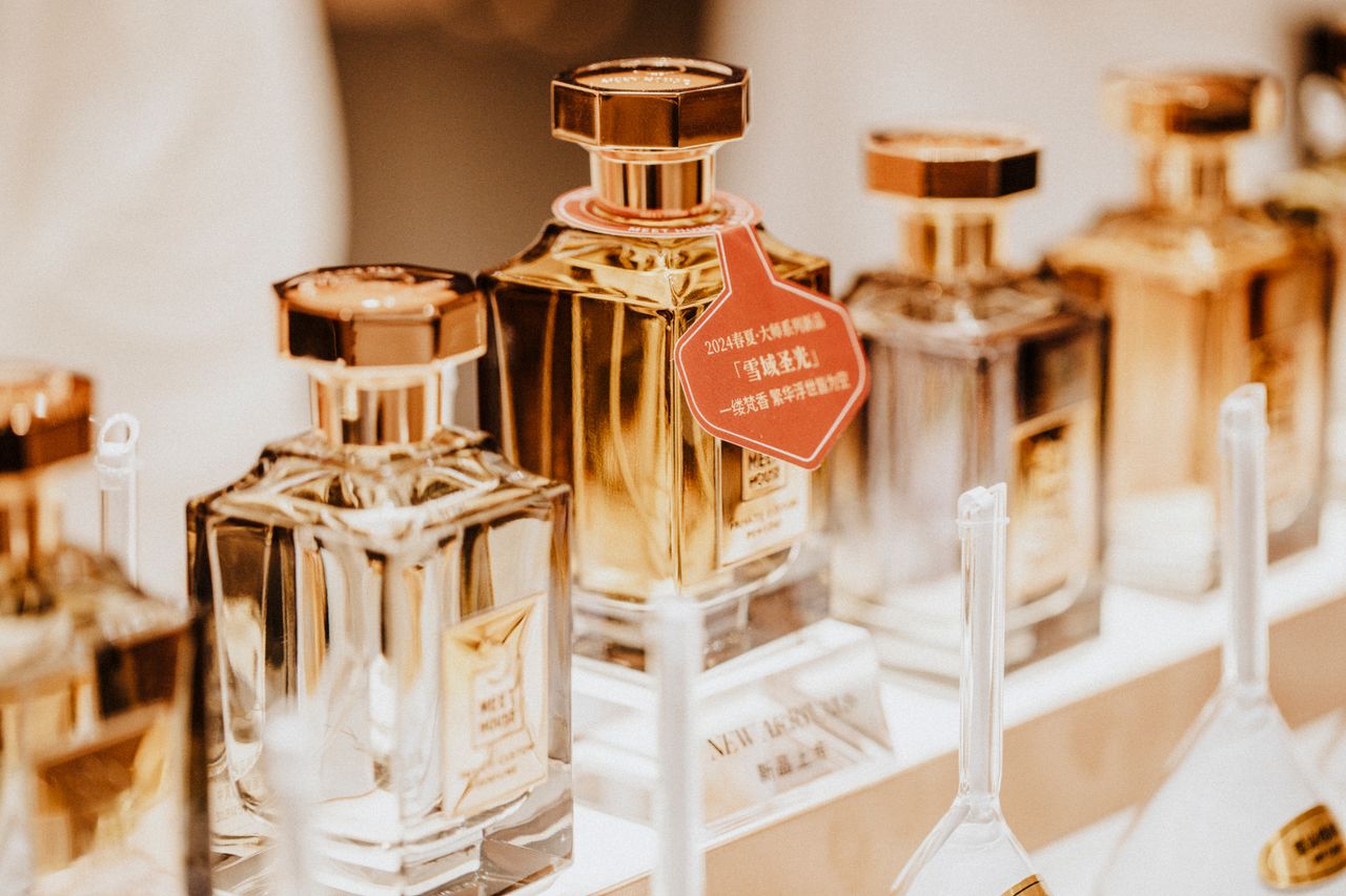 About Elegant collection of perfume bottles showcasing luxury fragrances in a stylish retail display.